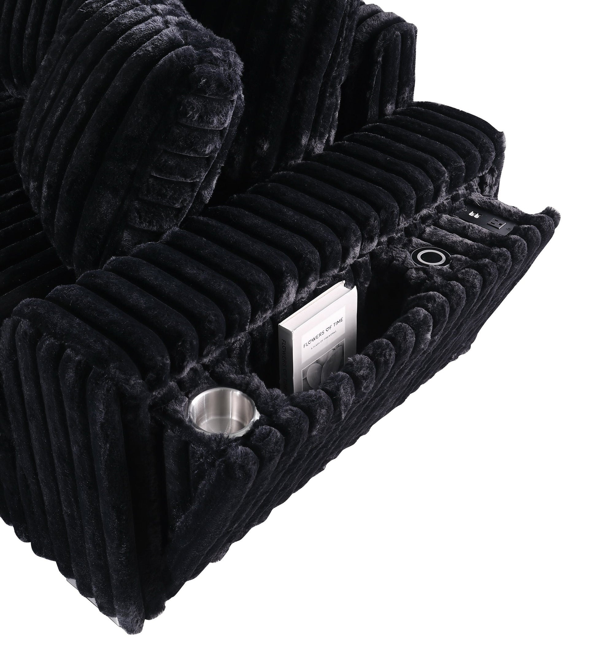 Black textured sectional sofa with Bluetooth console, ottoman, and stainless steel legs in a modern living room