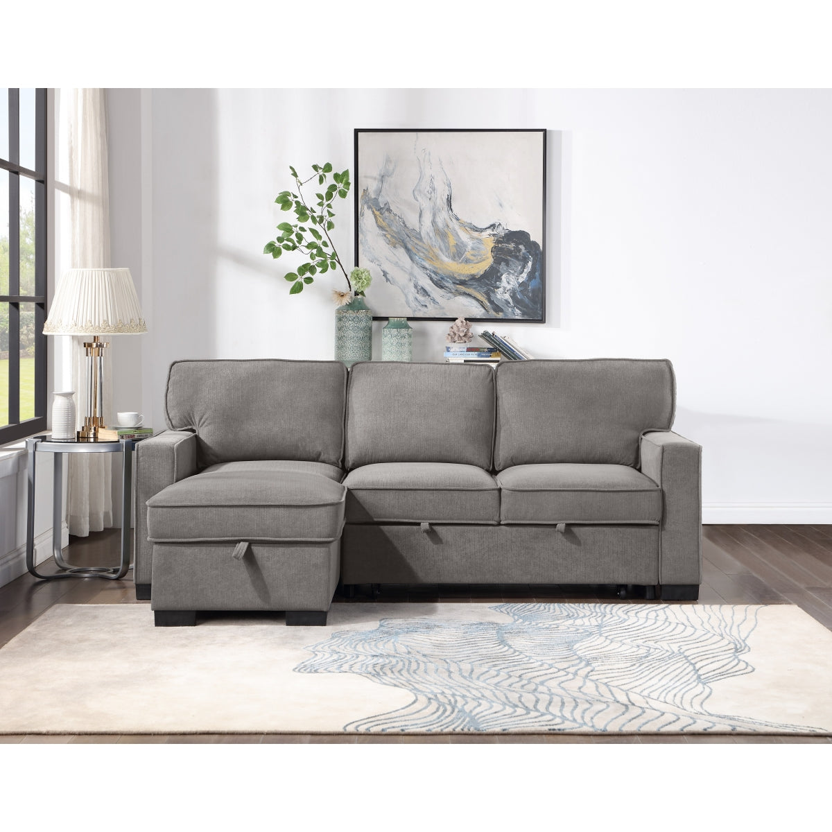 Gray fabric 2-piece sectional sofa with pull-out bed and storage chaise