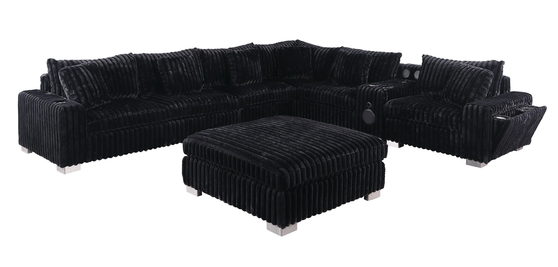 Black textured sectional sofa with Bluetooth console, ottoman, and stainless steel legs in a modern living room