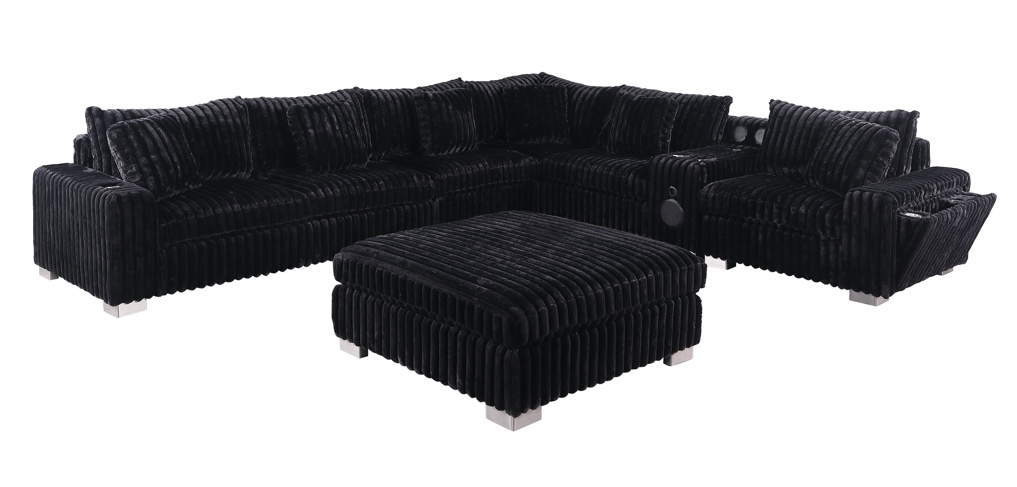 Black textured sectional sofa with Bluetooth console, ottoman, and stainless steel legs in a modern living room