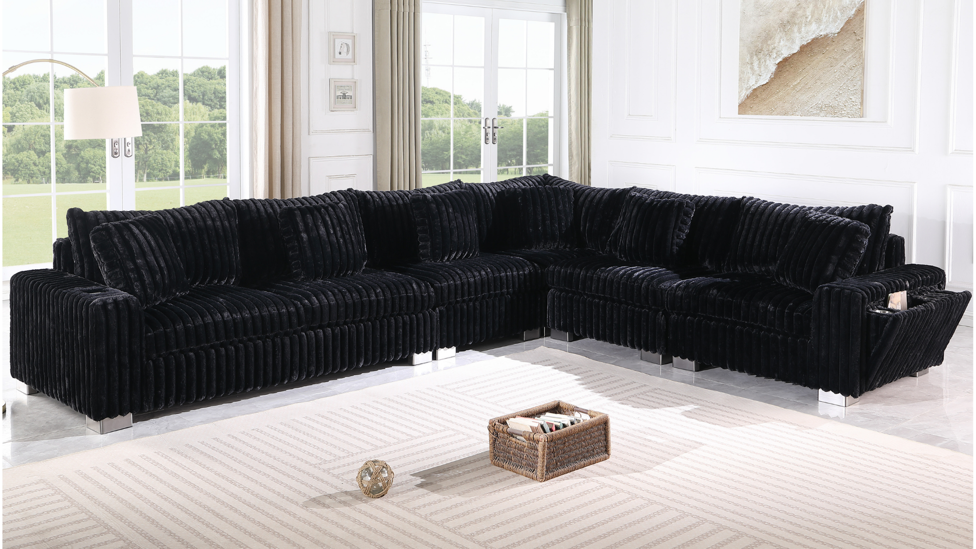 Black textured sectional sofa with Bluetooth console, ottoman, and stainless steel legs in a modern living room