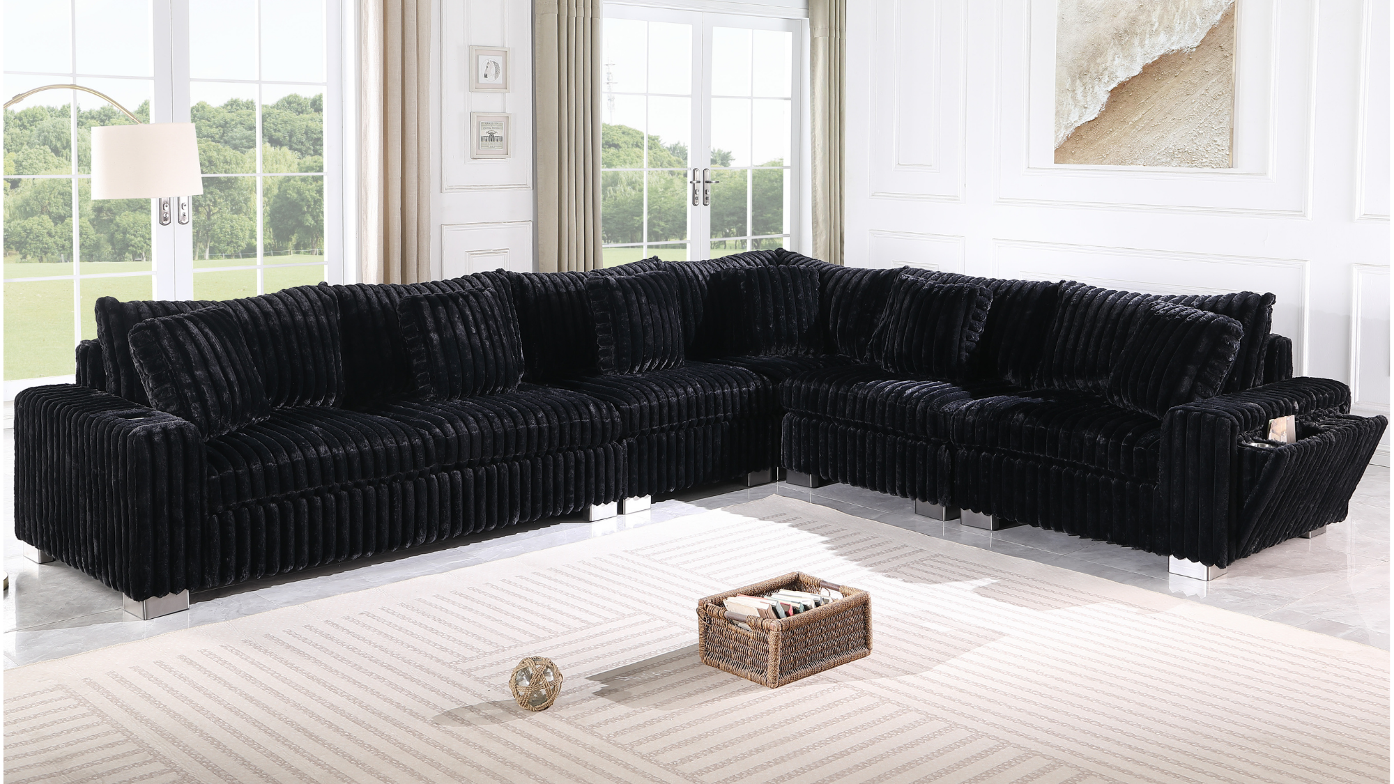Black textured sectional sofa with Bluetooth console, ottoman, and stainless steel legs in a modern living room