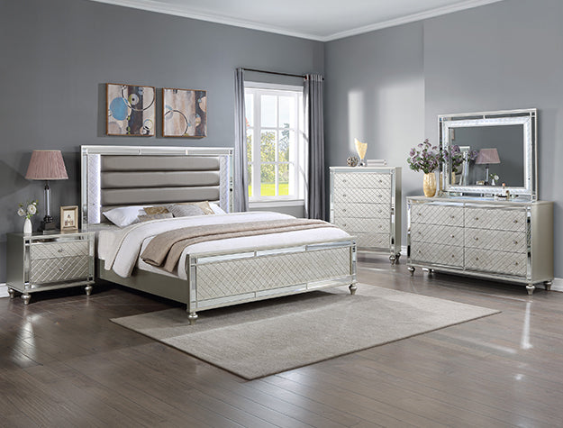 Cristian champagne nightstand with mirrored trim in a glam bedroom setting