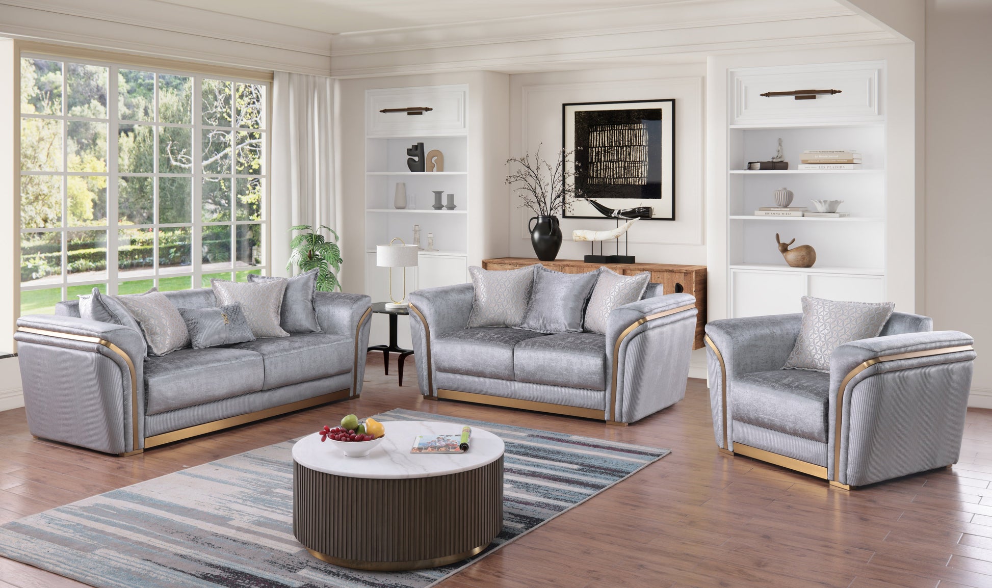 Torino Grey sofa, loveseat, and chair set with gold-tone trim in a modern living room