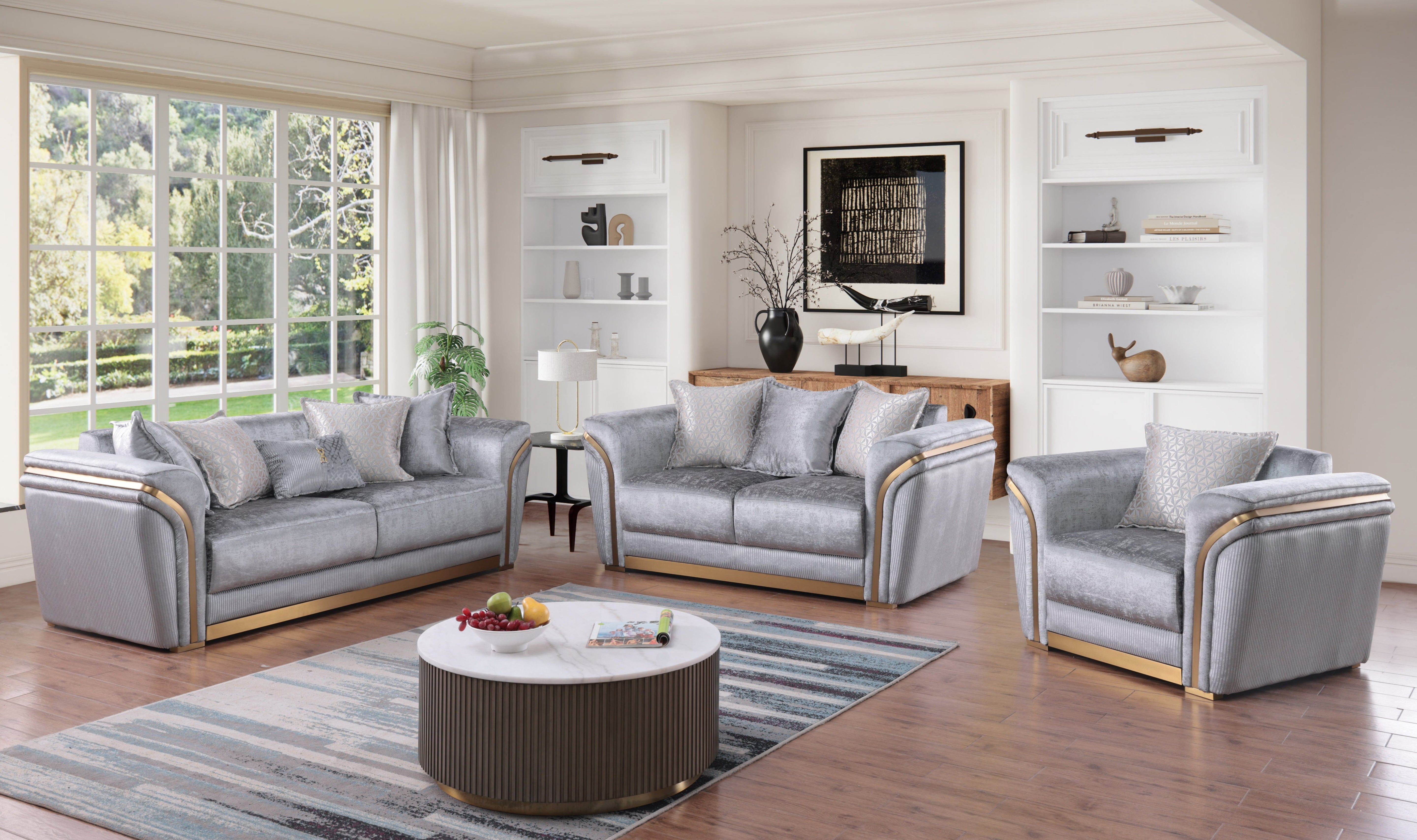 Torino Grey sofa, loveseat, and chair set with gold-tone trim in a modern living room