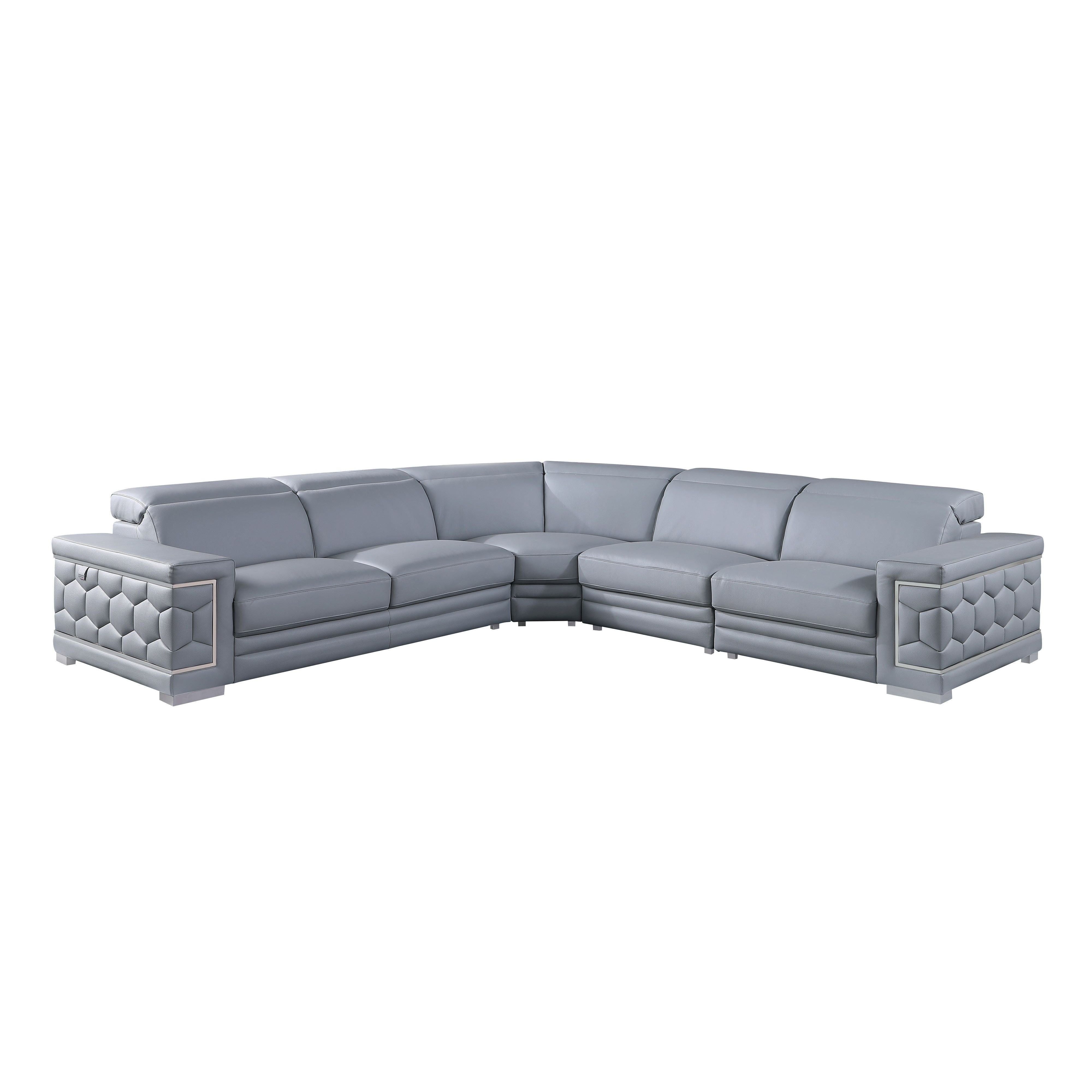 Favo 4-piece light blue-grey Italian leather sectional sofa with hexagon-tufted arms and chrome trim in a modern living room