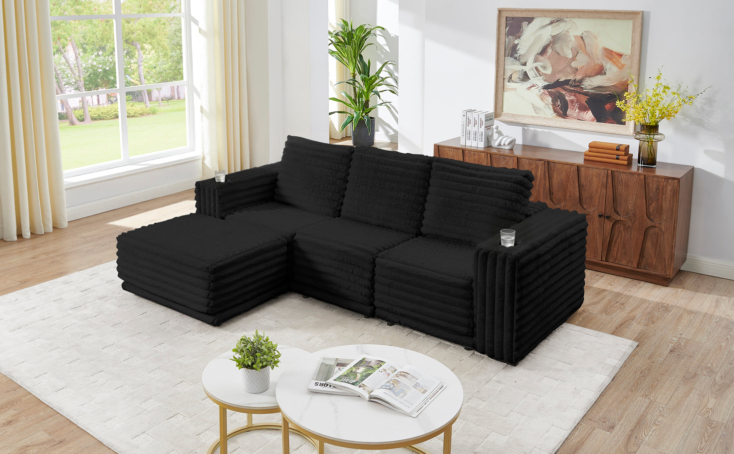 S101 Nuve black modular sectional sofa with ottomans in a living room