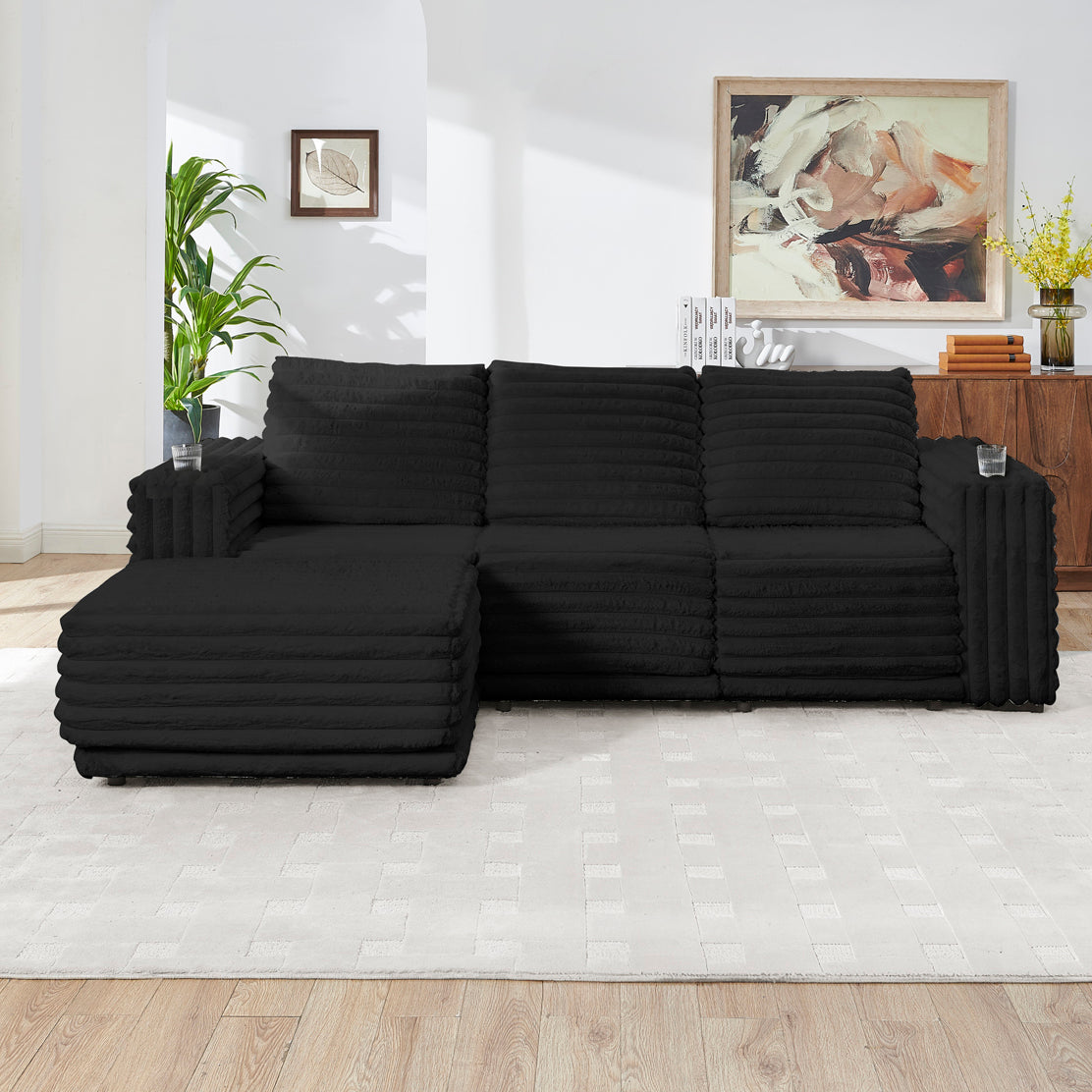 S101 Nuve black modular sectional sofa with ottomans in a living room