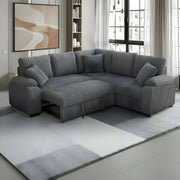 Grey corduroy sectional sofa with pullout bed and matching pillows in a modern living room