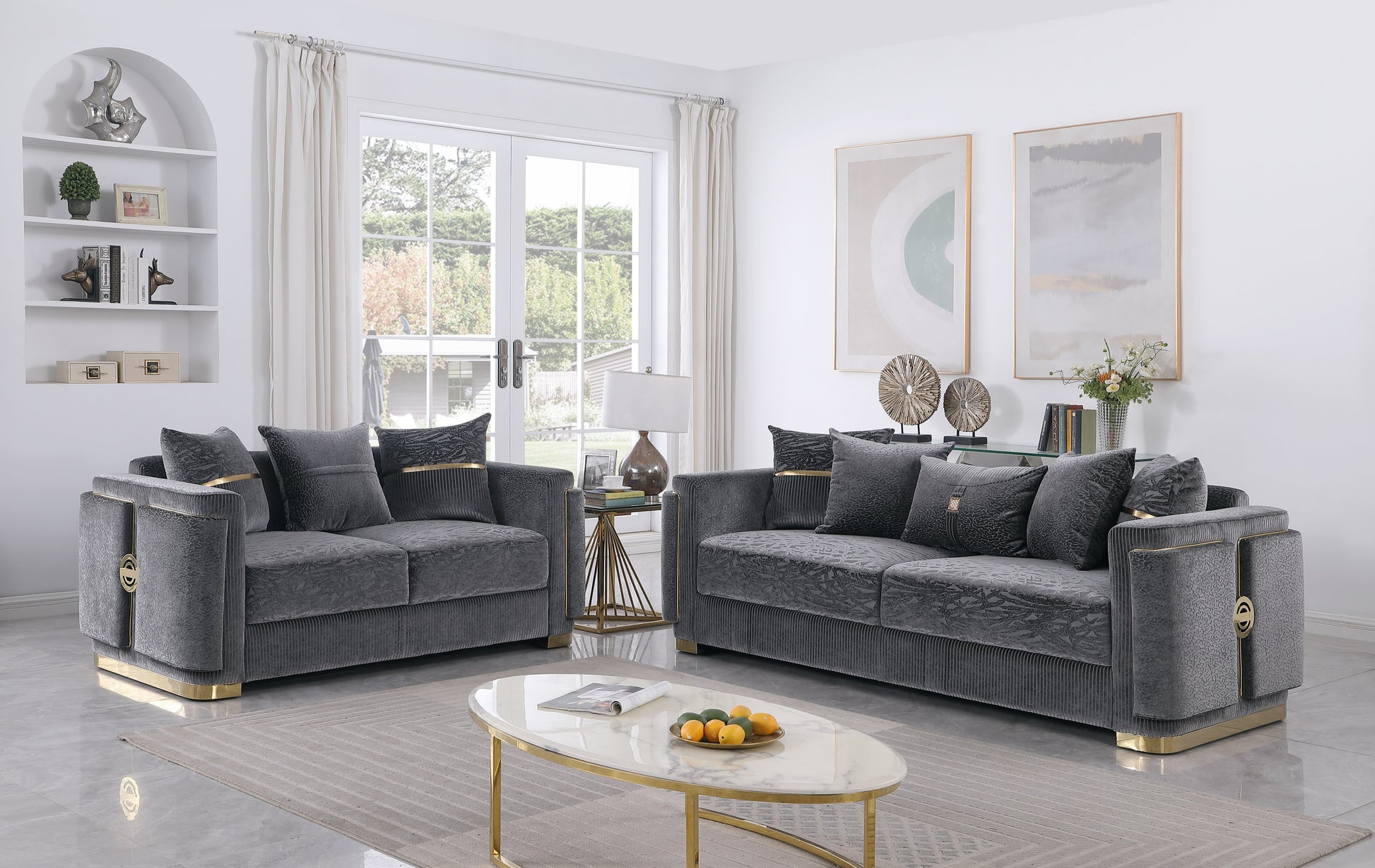 Capri Collection grey sofa, loveseat, and chair set with gold-tone trim and designer pillows in a modern living room