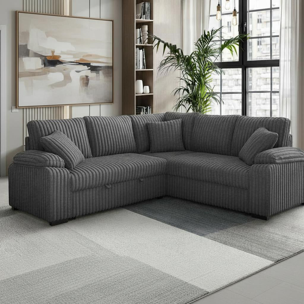 Grey corduroy sectional sofa with pullout bed and matching pillows in a modern living room