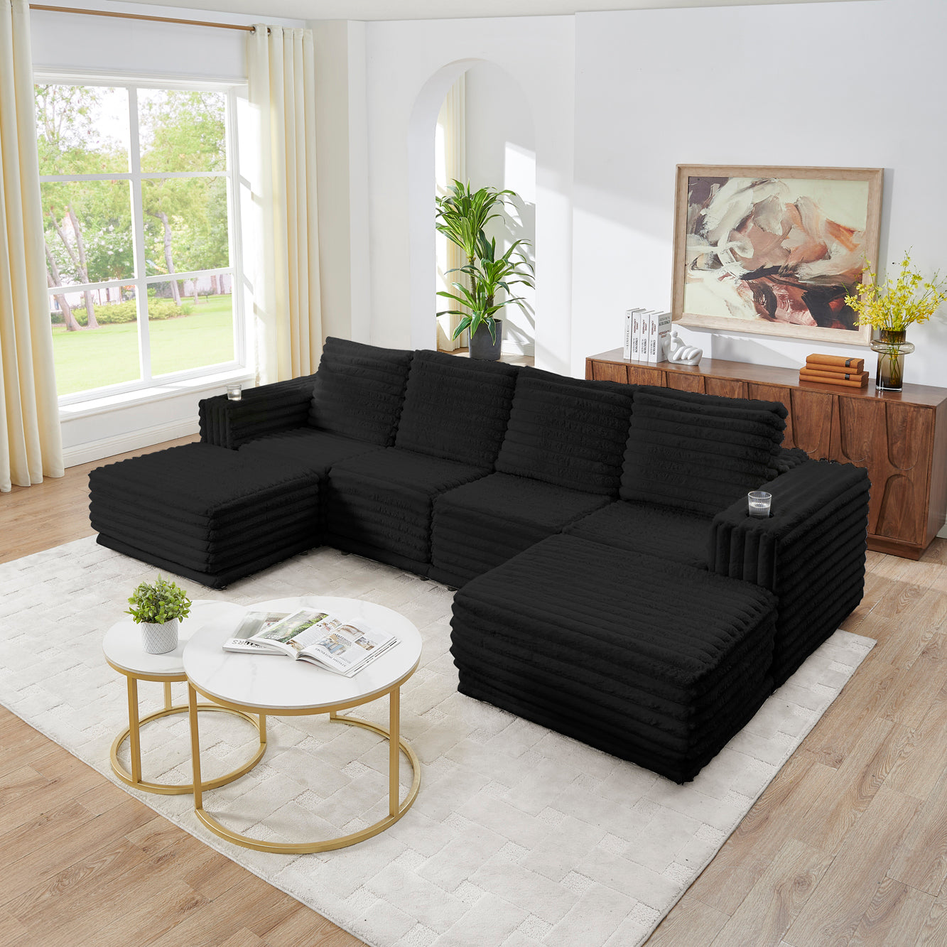 S101 Nuve black modular sectional sofa with ottomans in a living room