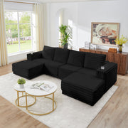 S101 Nuve black modular sectional sofa with ottomans in a living room