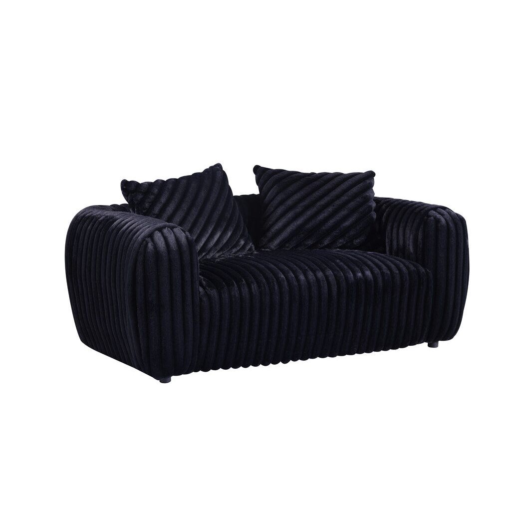 Eli black stripe fabric sofa with rounded arms and toss pillows in a modern living room
