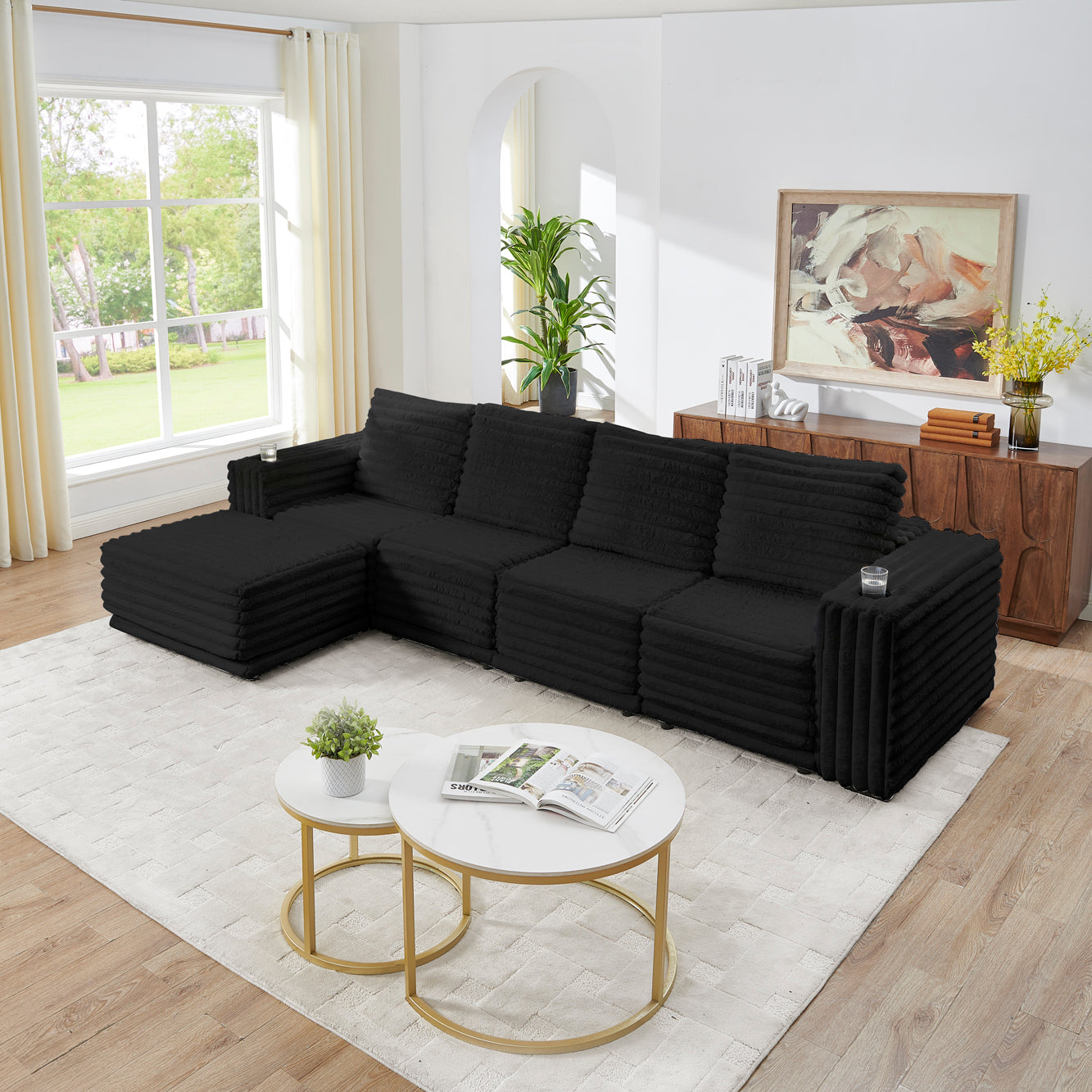 S101 Nuve black modular sectional sofa with ottomans in a living room