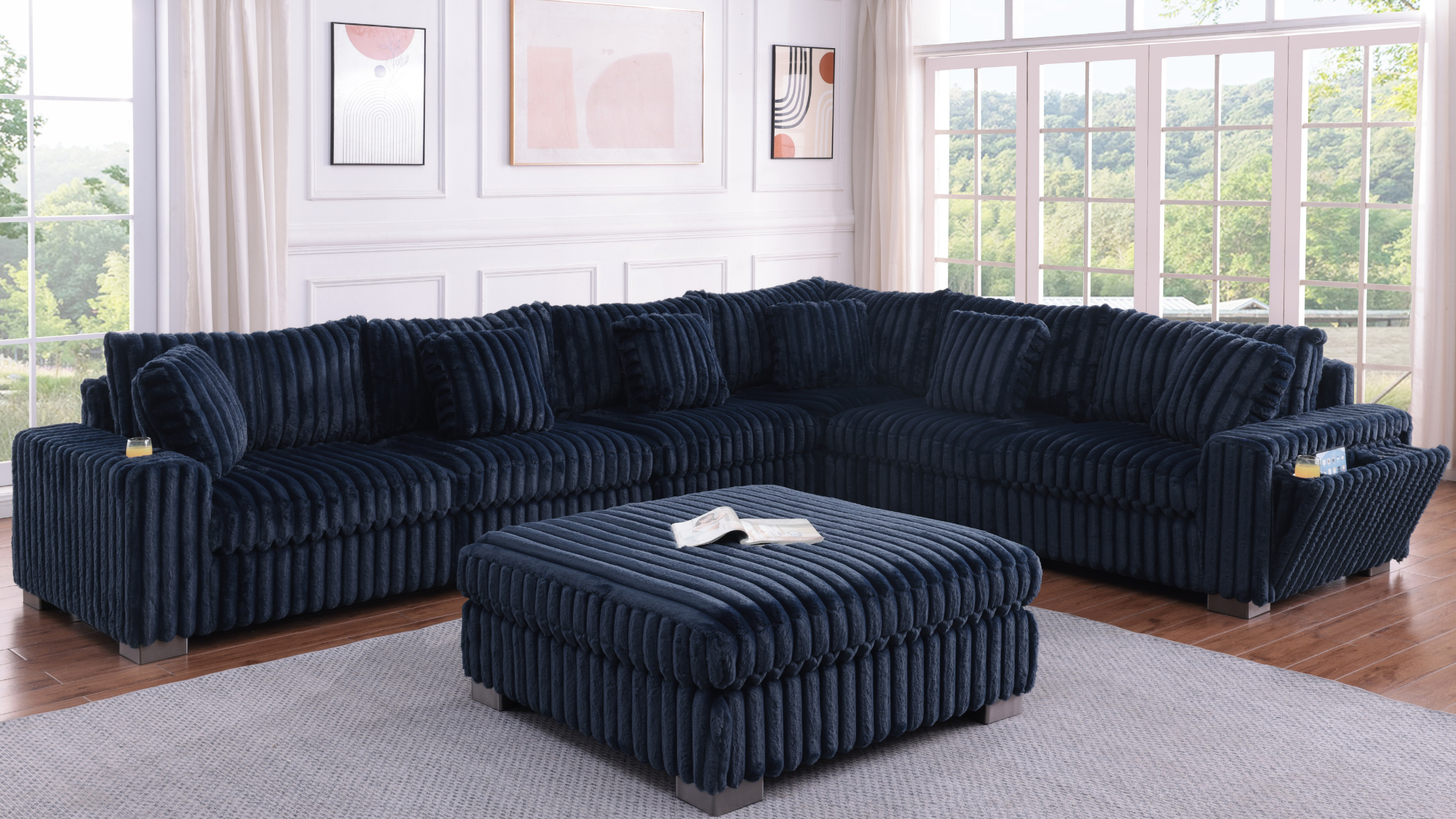 Blue textured sectional sofa with Bluetooth console, cupholders, and ottoman in a living room