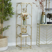 Gold glass shelf styled in minimalist living room with modern decor