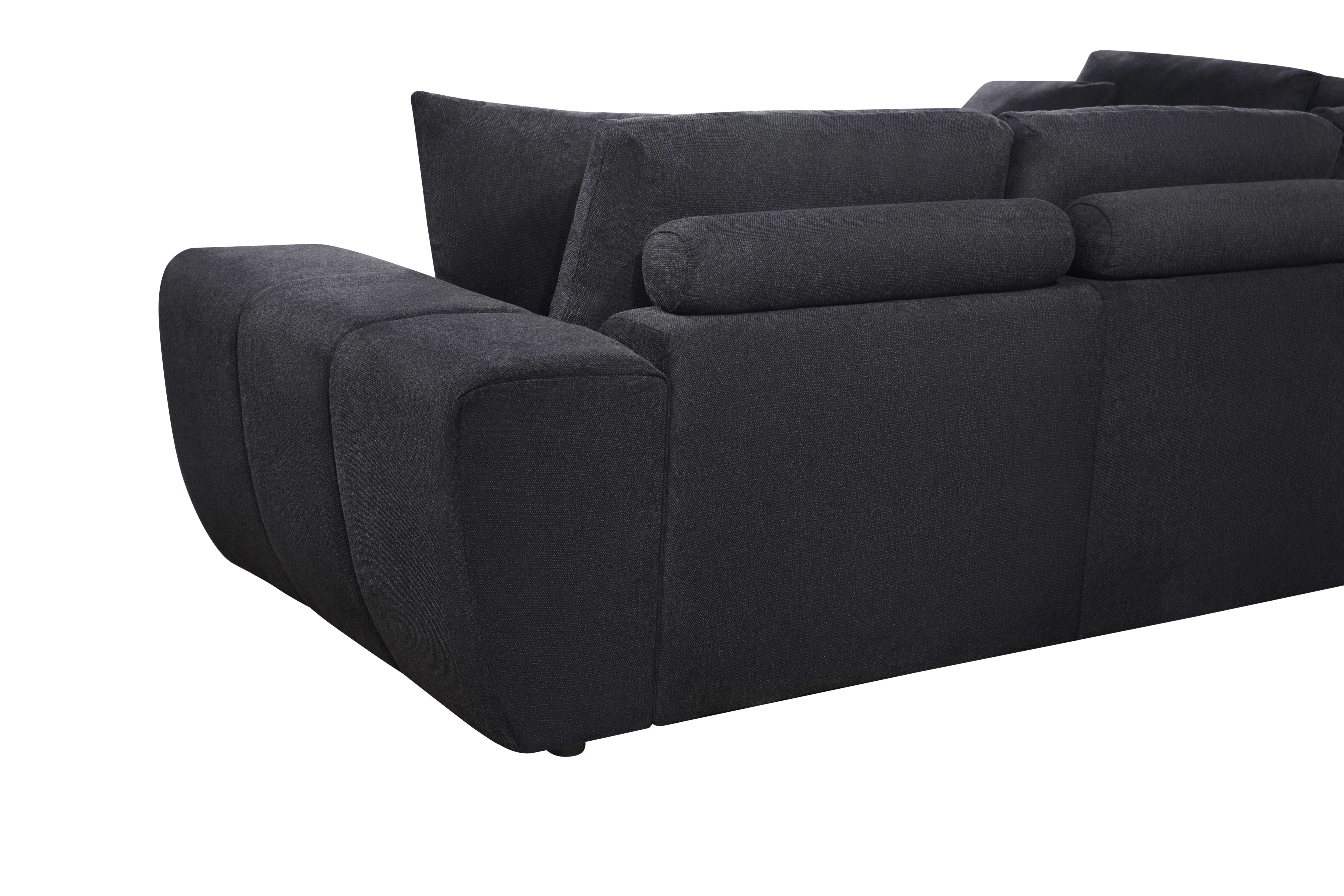 Black low-profile L-shaped sectional sofa with vertical channel tufting in a modern living room