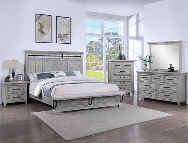 Beckett weathered gray panel bed with metal accents in a bedroom setting