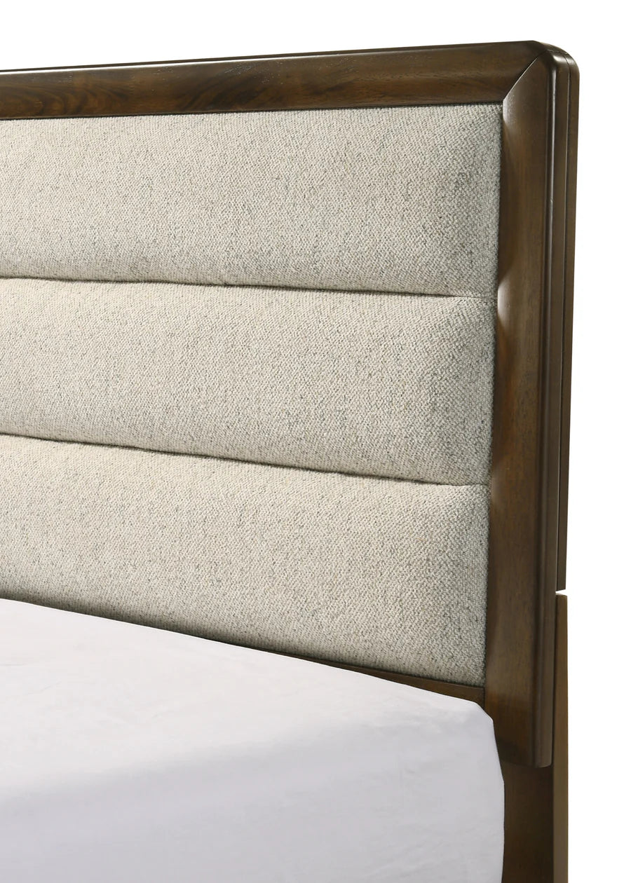 Close-up of a upholstered headboard with wooden frame on a white background