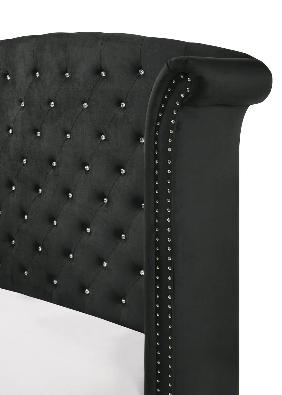 Black tufted headboard with decorative studs 