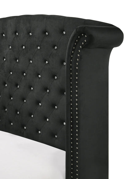 Black tufted headboard with decorative studs 