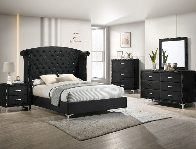 Black bedroom furniture set with bed, dresser, and nightstands in a room.