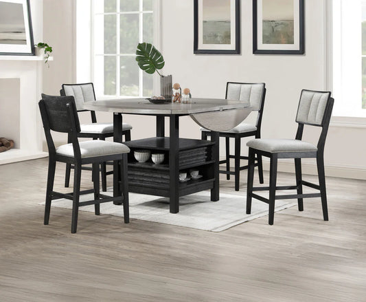 Dining room set with a round table and four chairs in a well-lit room.
