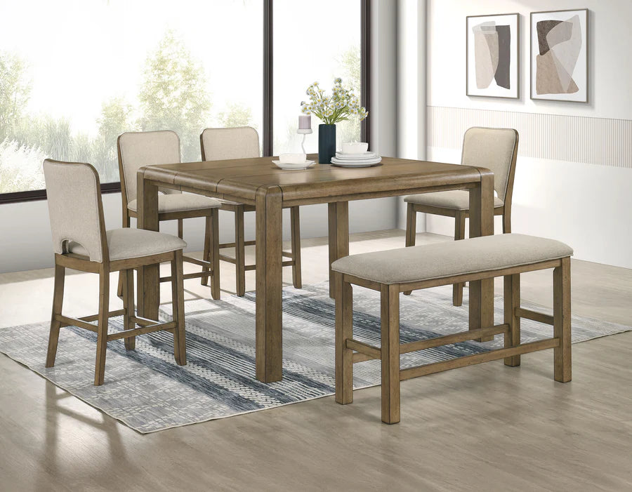Dining room set with wooden table, chairs, and bench on a rug.