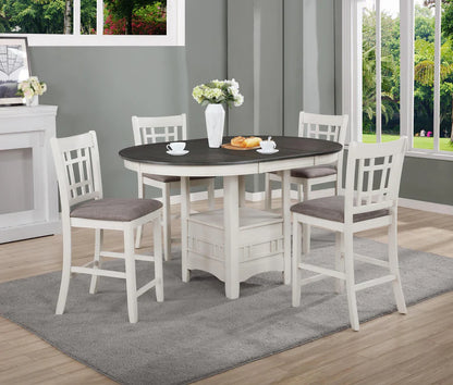 Dining room set with a round table and four chairs on a gray rug.