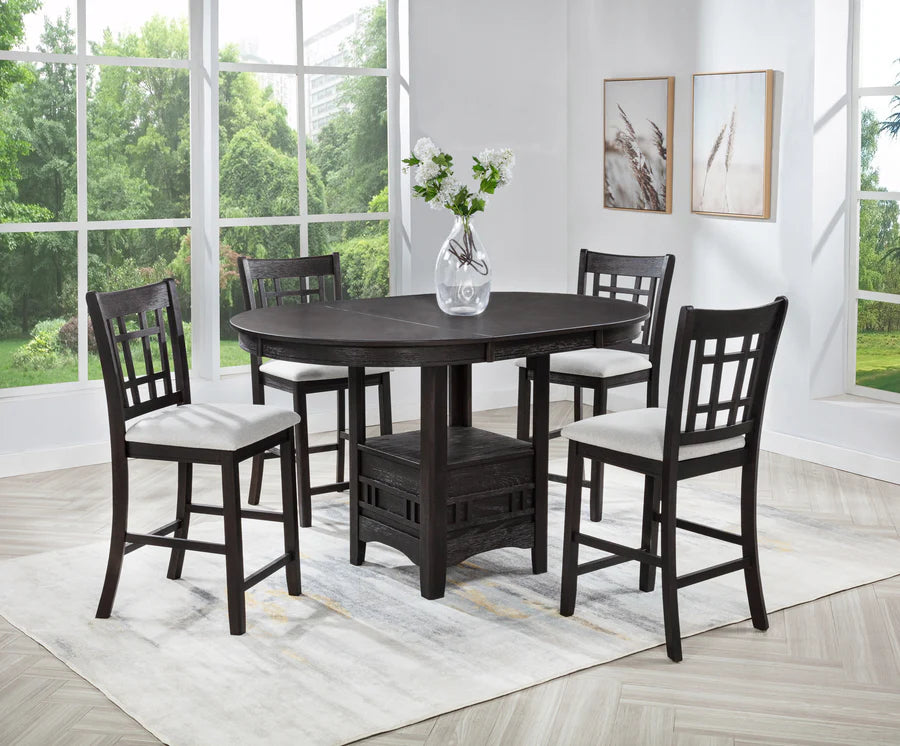 Dining room set with a dark wood table and chairs in a bright room with large windows.