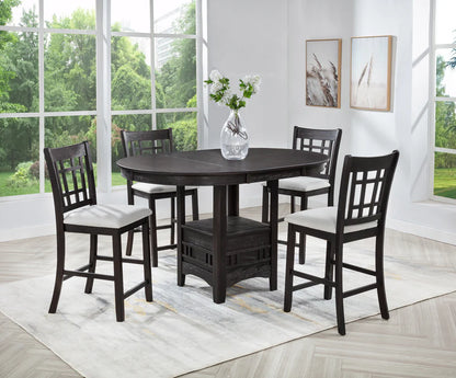 Dining room set with a dark wood table and chairs in a bright room with large windows.