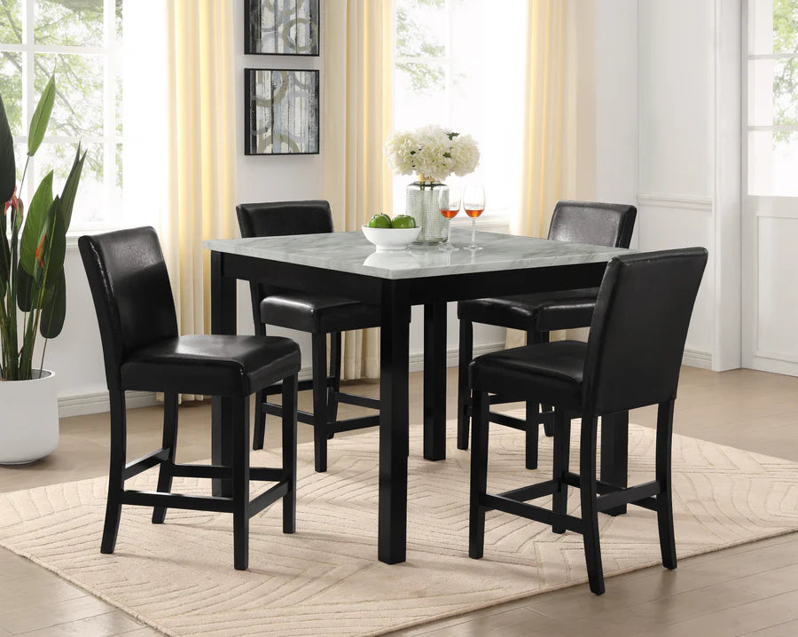 Dining room with a black dining table and four matching chairs in a well-lit room.