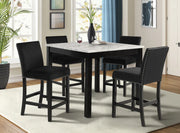 Dining room with a marble-top table and black chairs.