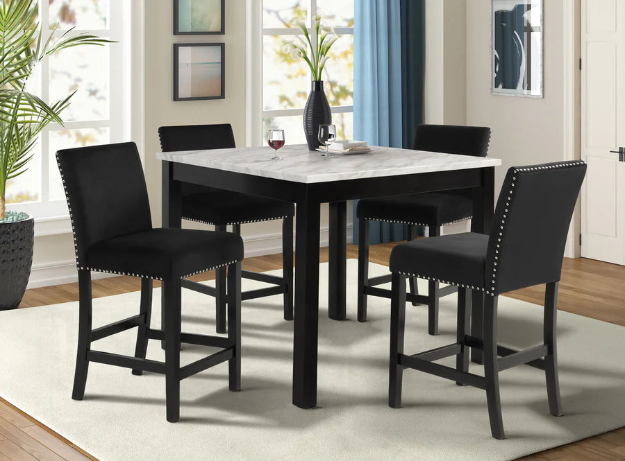 Dining room with a marble-top table and black chairs.