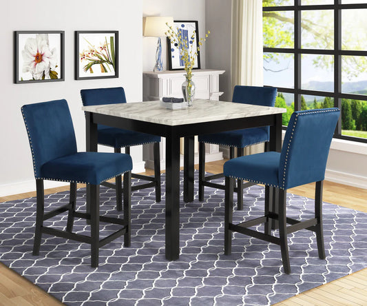 Dining room with a black dining table and blue chairs on a patterned rug.