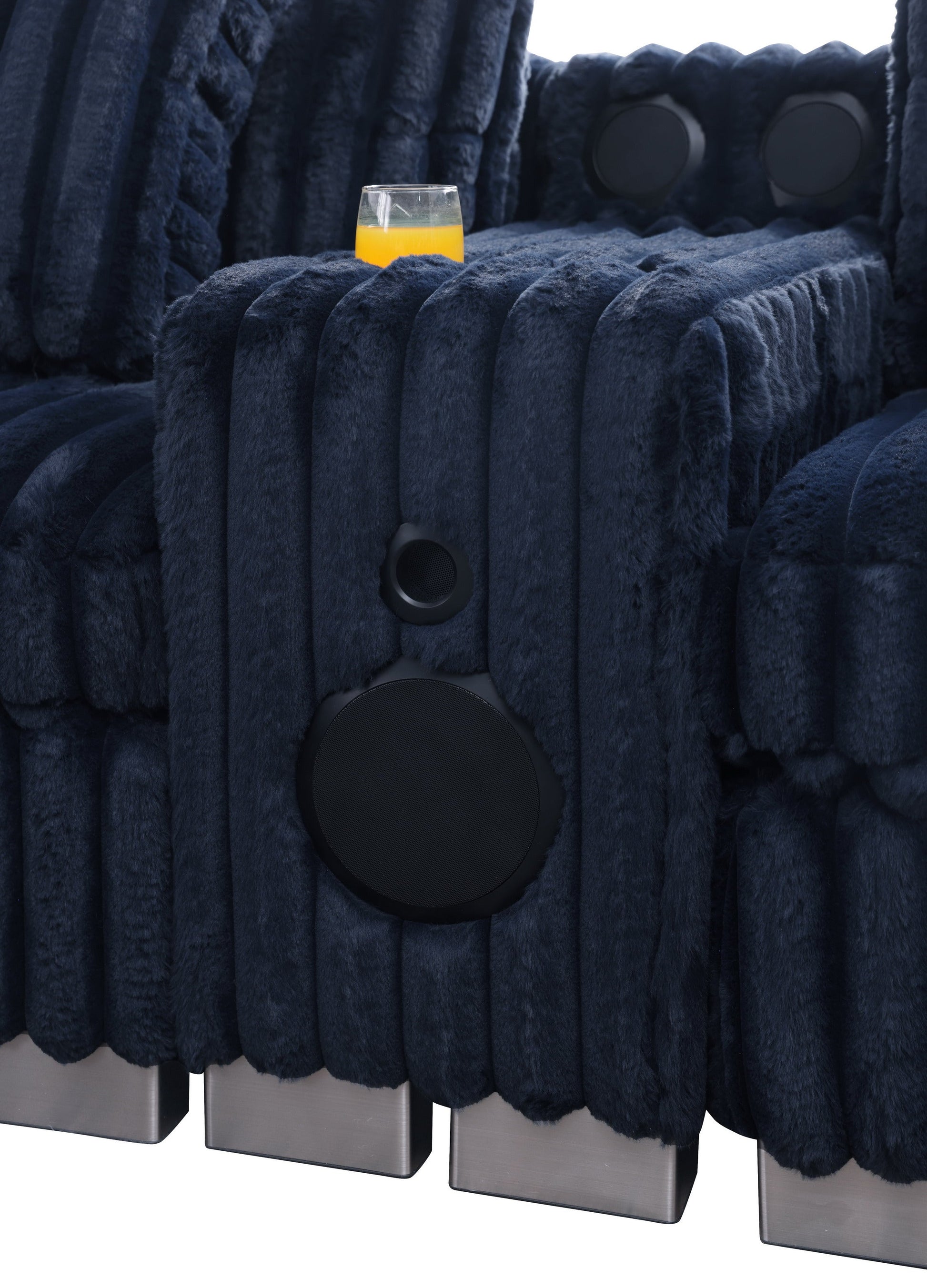 Blue textured sectional sofa with Bluetooth console, cupholders, and ottoman in a living room