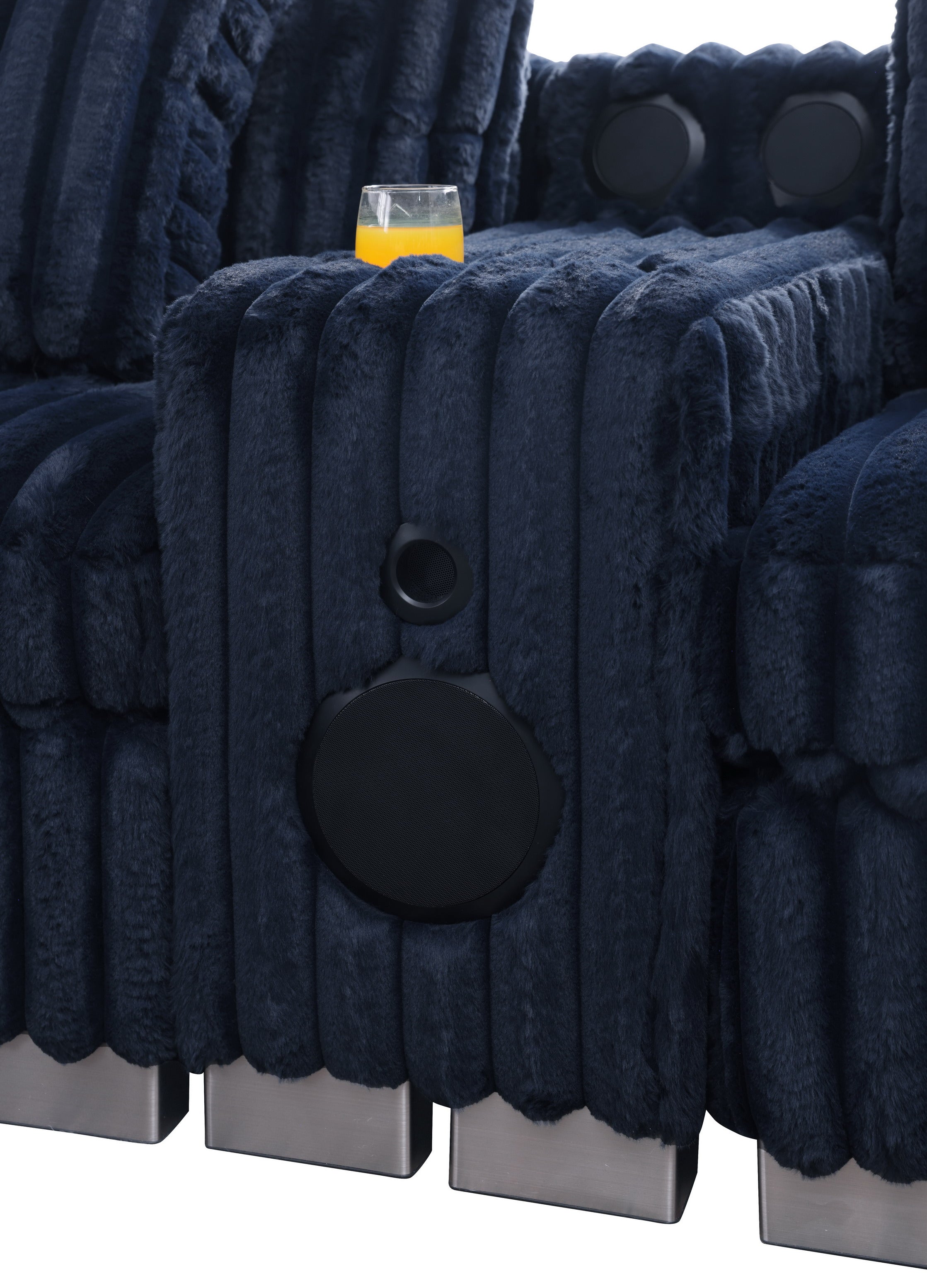 Blue textured sectional sofa with Bluetooth console, cupholders, and ottoman in a living room