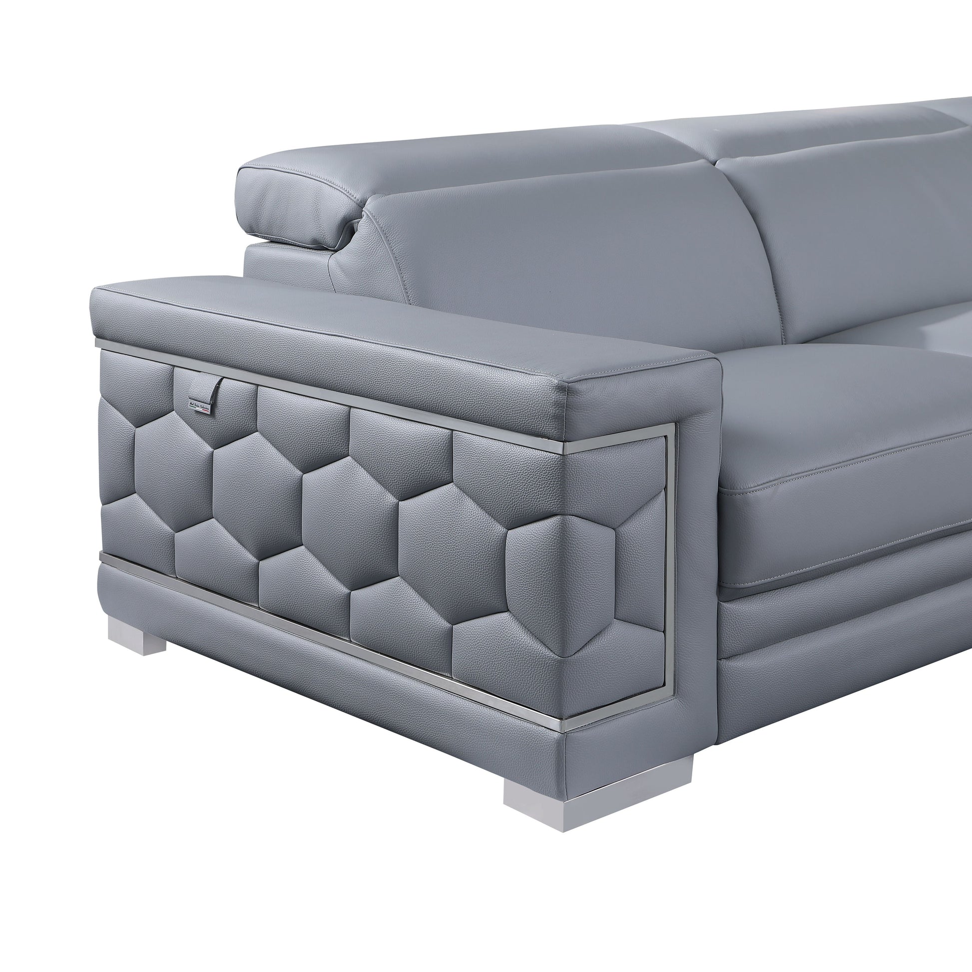 Favo 4-piece light blue-grey Italian leather sectional sofa with hexagon-tufted arms and chrome trim in a modern living room
