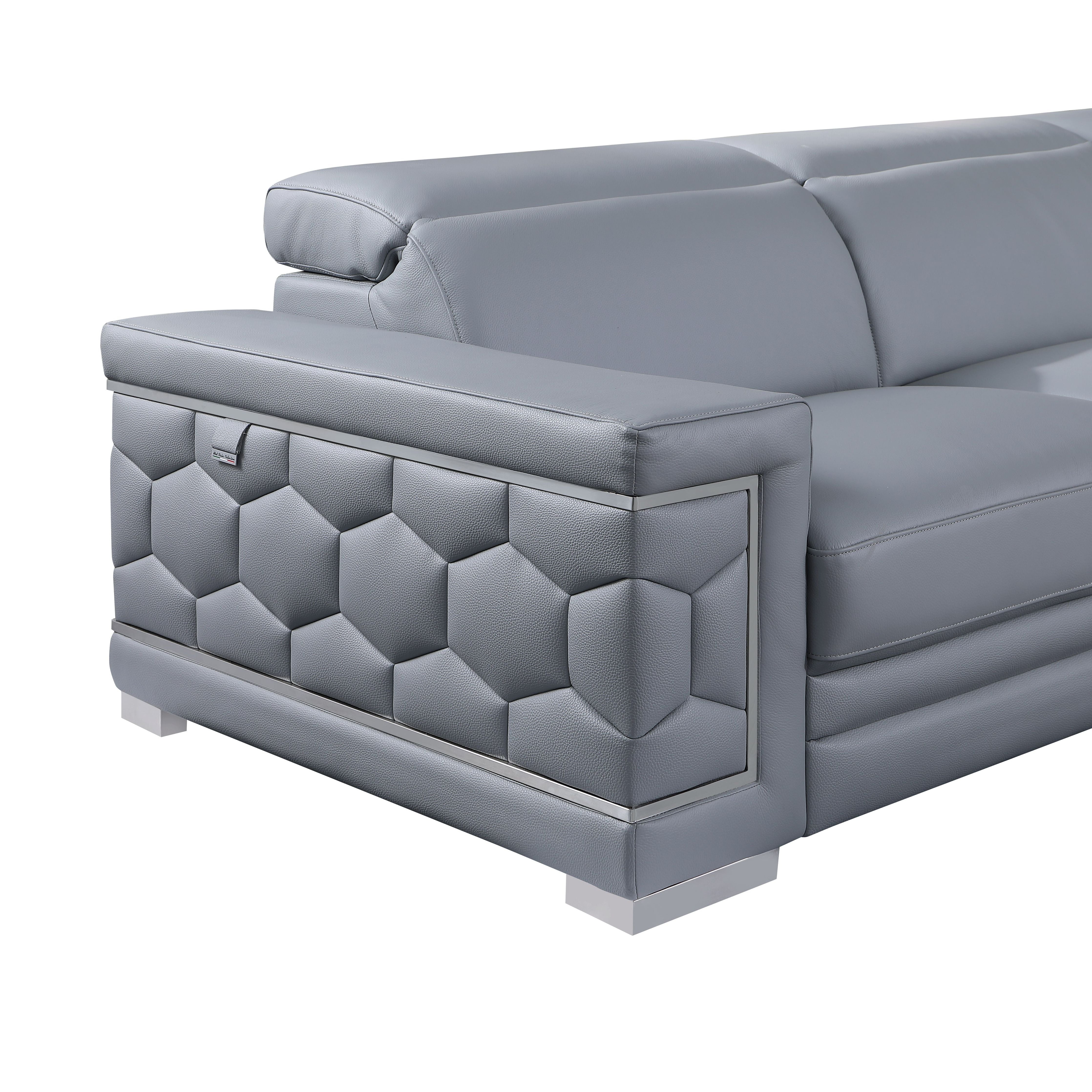 Favo 4-piece light blue-grey Italian leather sectional sofa with hexagon-tufted arms and chrome trim in a modern living room