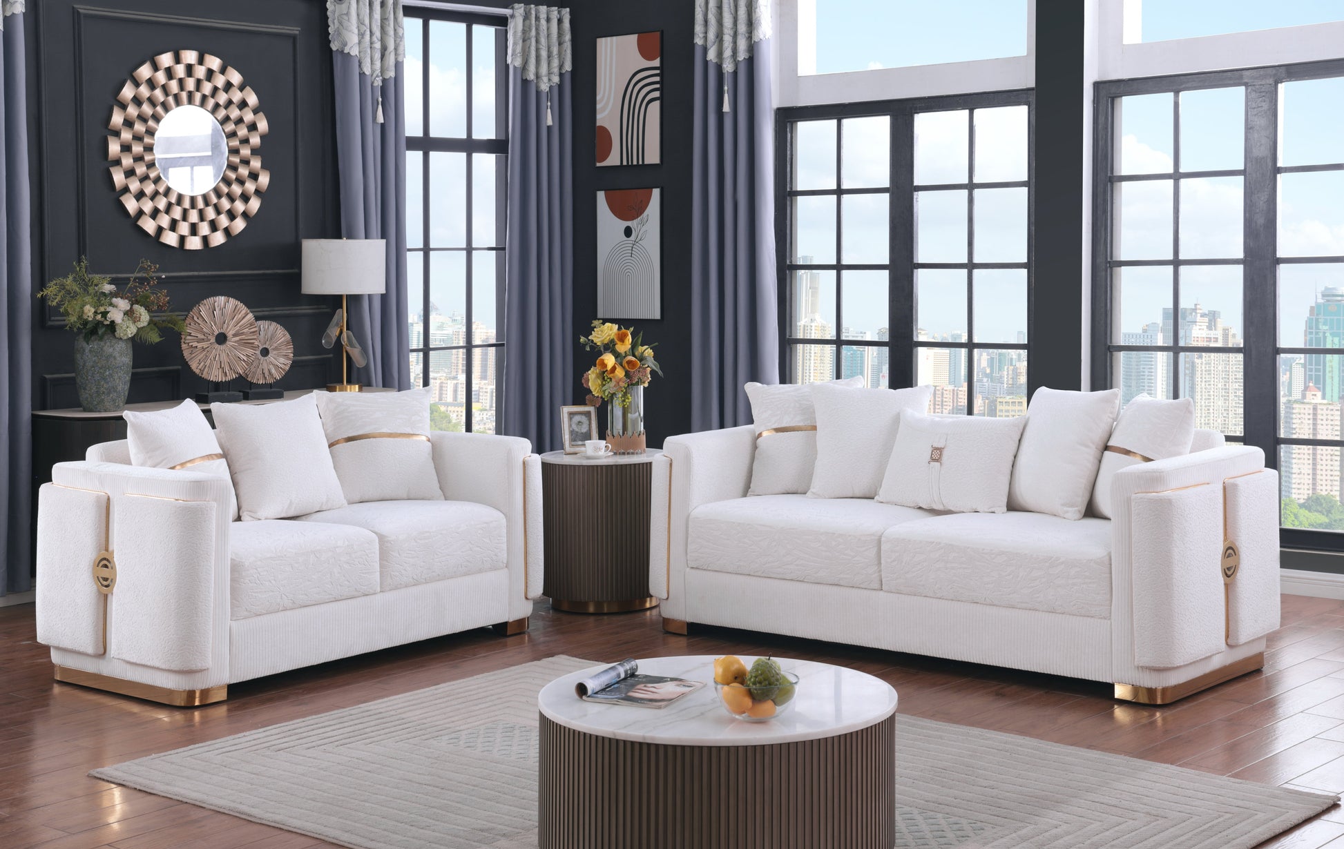 Capri white sofa collection with gold trim and designer pillows in a modern living room