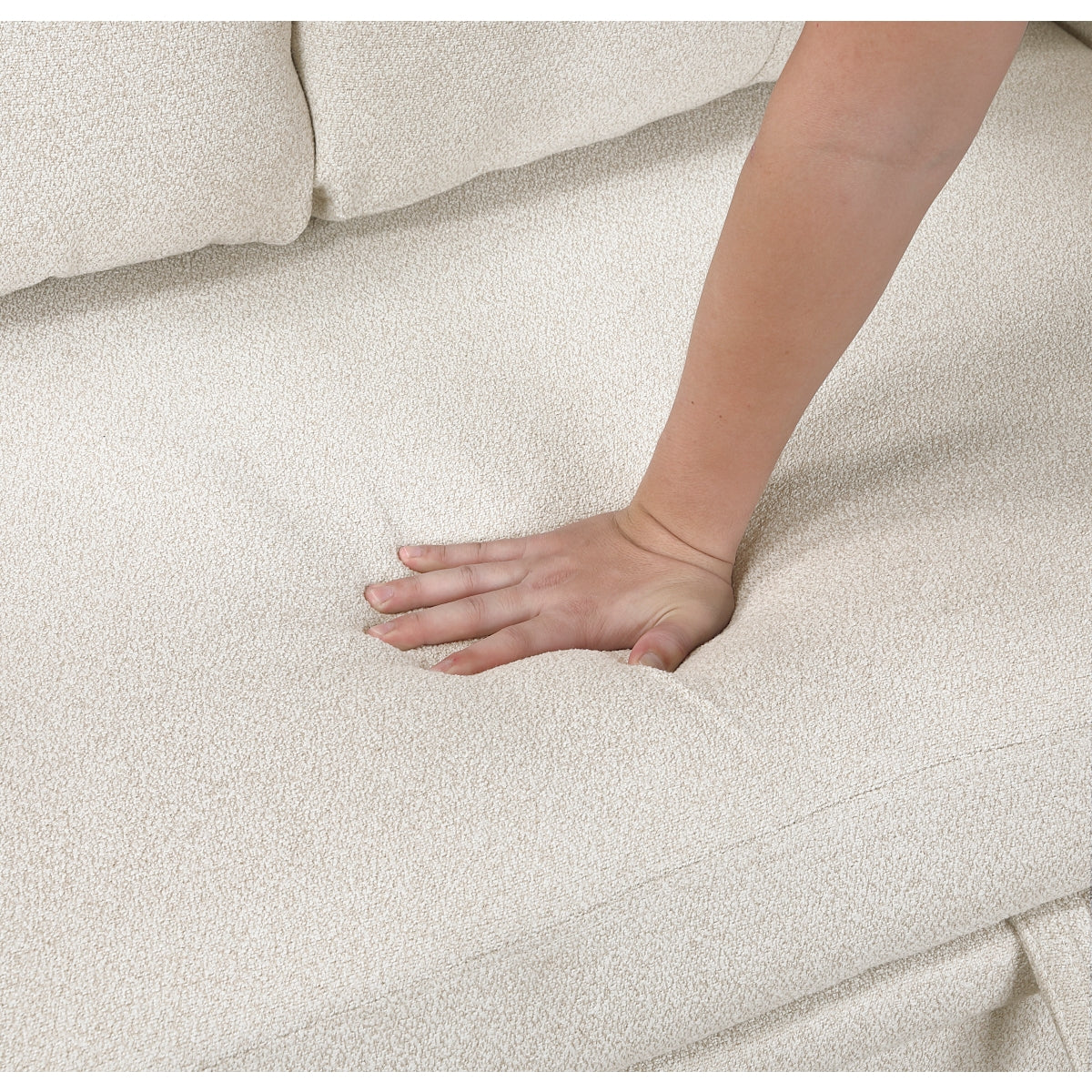 Beige boucle sectional sofa with pull-out bed, storage chaises, and built-in shelving