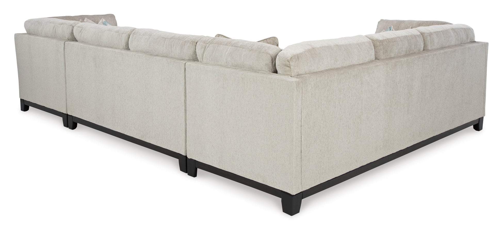 Stone-colored 3-piece sectional sofa with chaise and tufted cushions in a modern living room