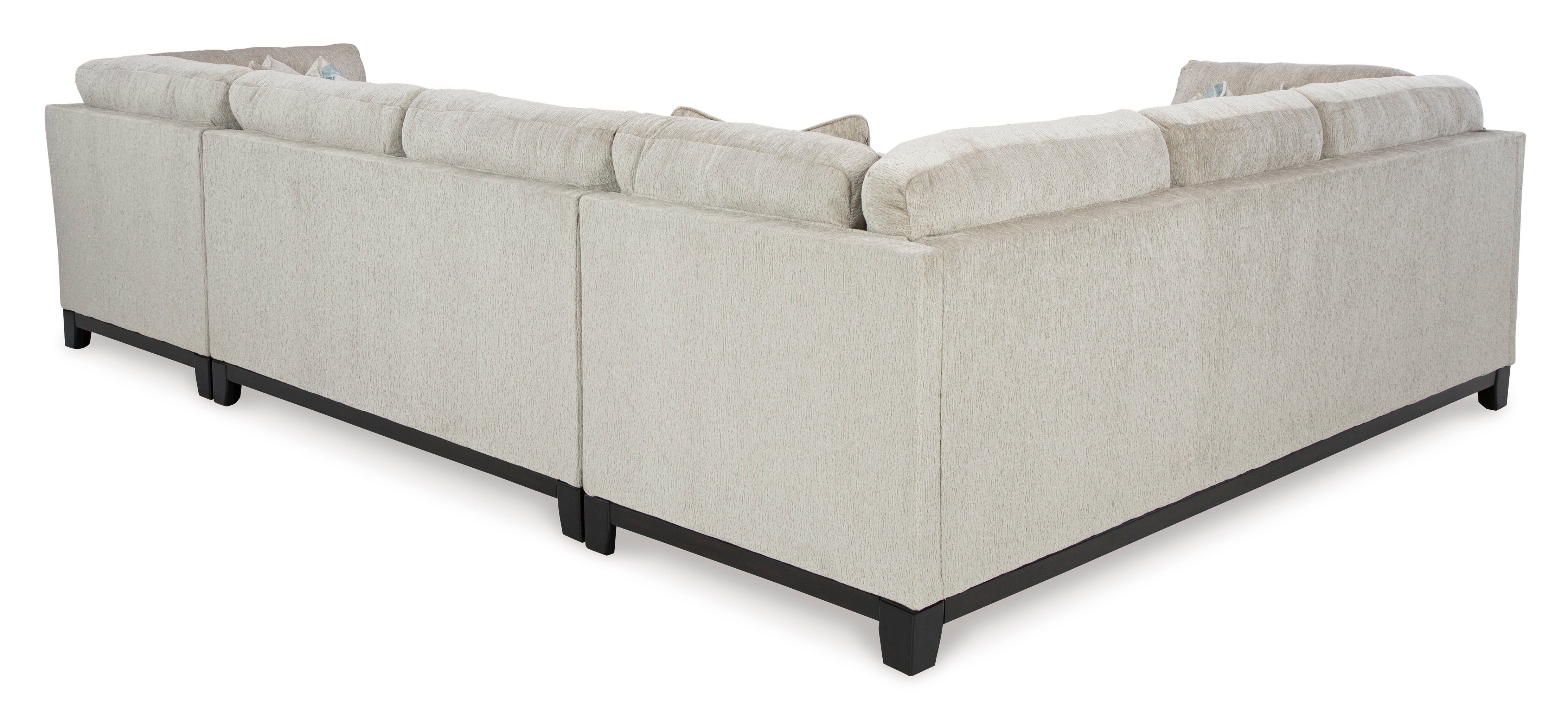 Stone-colored 3-piece sectional sofa with chaise and tufted cushions in a modern living room