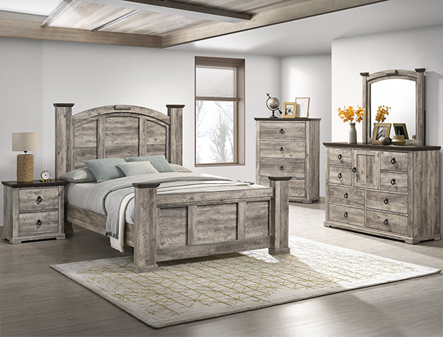Weathered grey panel bed with arched headboard and turned bedposts in a bedroom setting