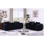 Eli black stripe fabric sofa with rounded arms and toss pillows in a modern living room