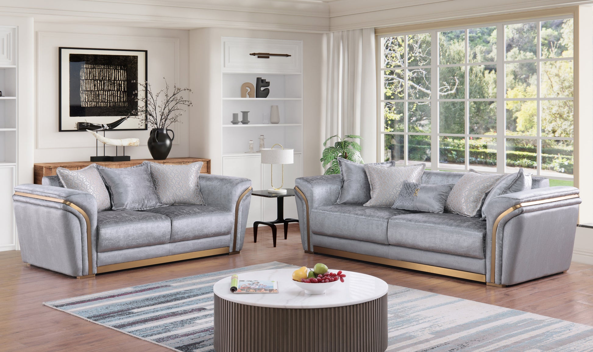 Torino Grey sofa, loveseat, and chair set with gold-tone trim in a modern living room