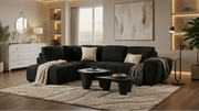 Black low-profile L-shaped sectional sofa with vertical channel tufting in a modern living room